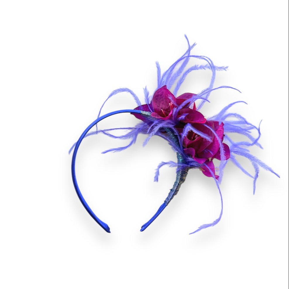 Handcrafted Magenta & Violet Bougainvillea Headband with magenta fabric bougainvillea flowers, wispy violet ostrich feathers and a slim blue headband.