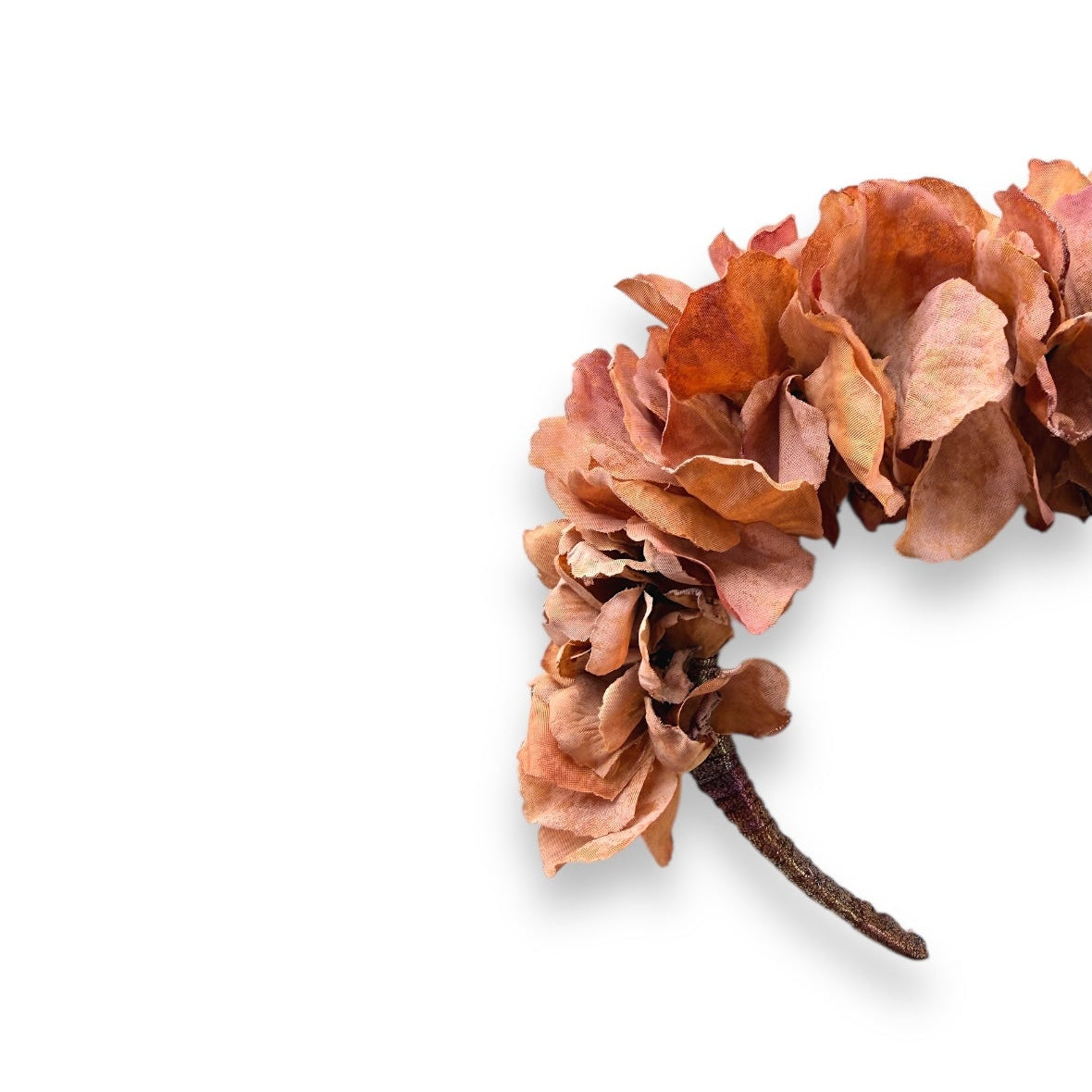 with realistic fabric hydrangeas in warm terracotta, dusty peach and earthy brown tones on a slim headband.