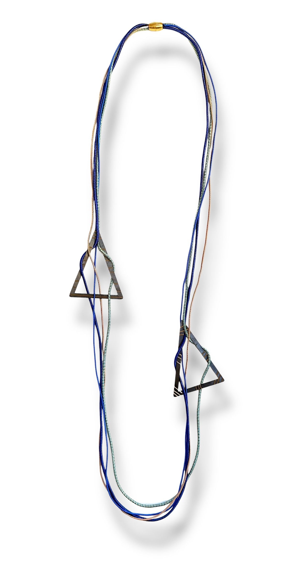 Long necklace with blue cotton cords on a white background