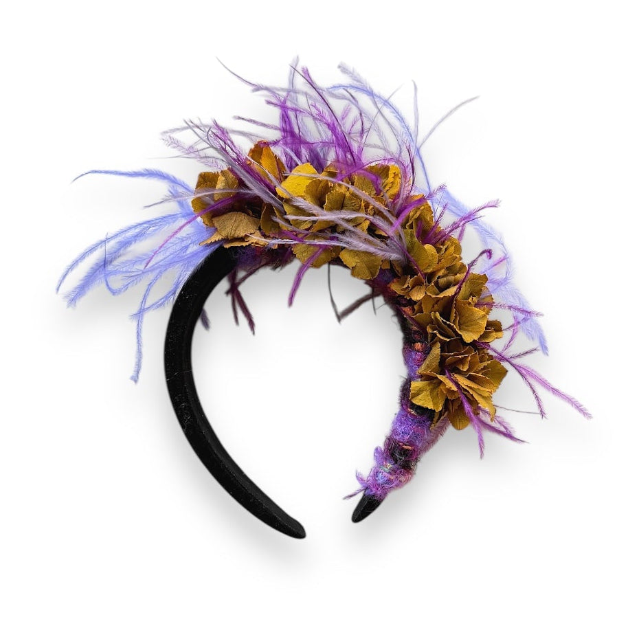 headband decorated with purple feathers