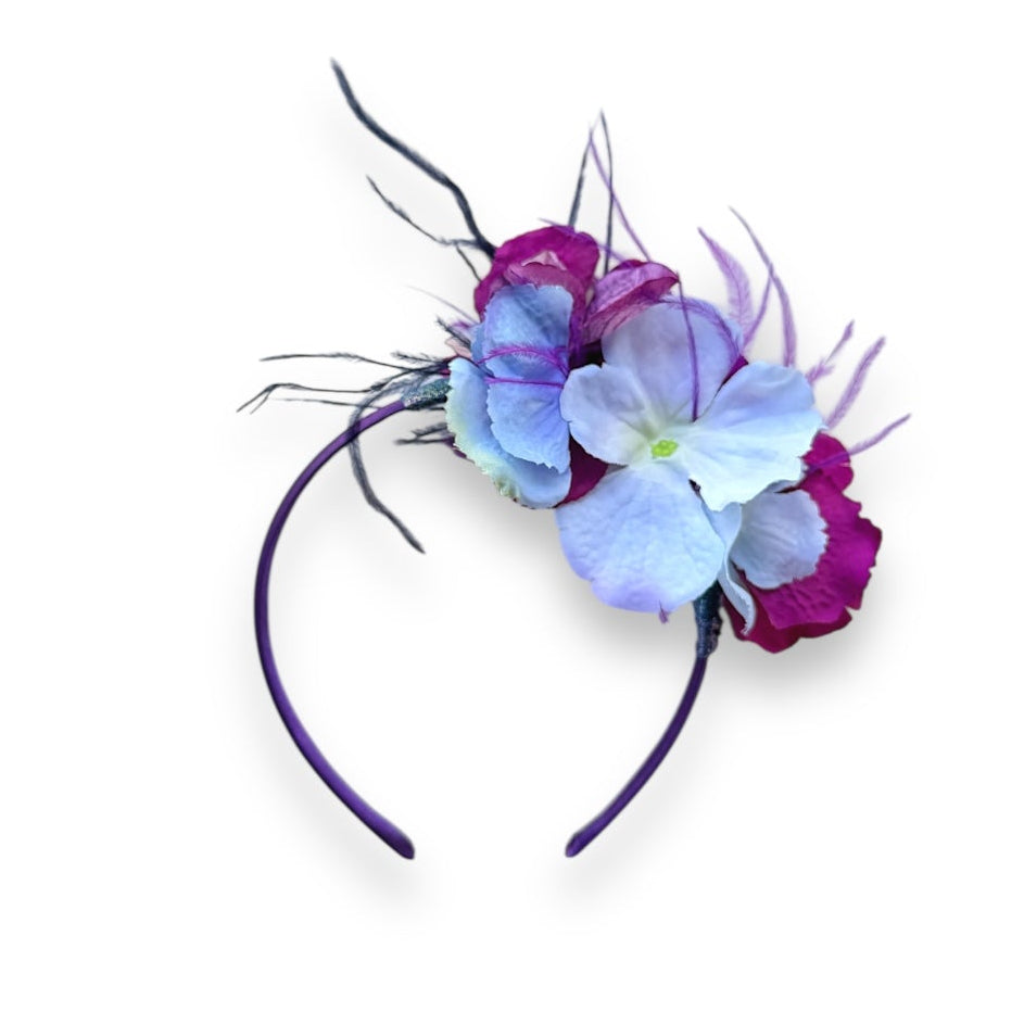 Handcrafted Blue & Magenta Hydrangea Headband with realistic fabric hydrangeas, purple and blue ostrich feathers and a slim purple headband.