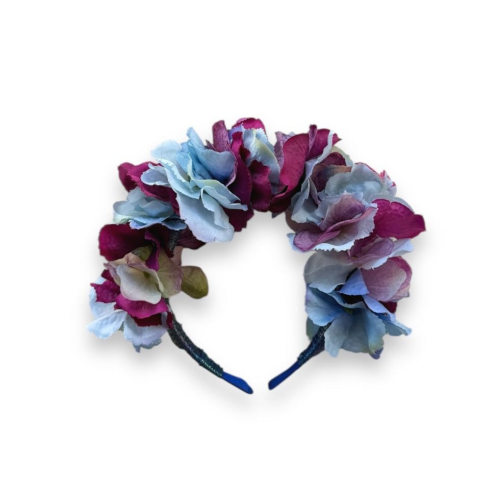 Floral headband, handcrafted with high-quality fabric hydrangeas in soft, layered shades of magenta, blue and purple.