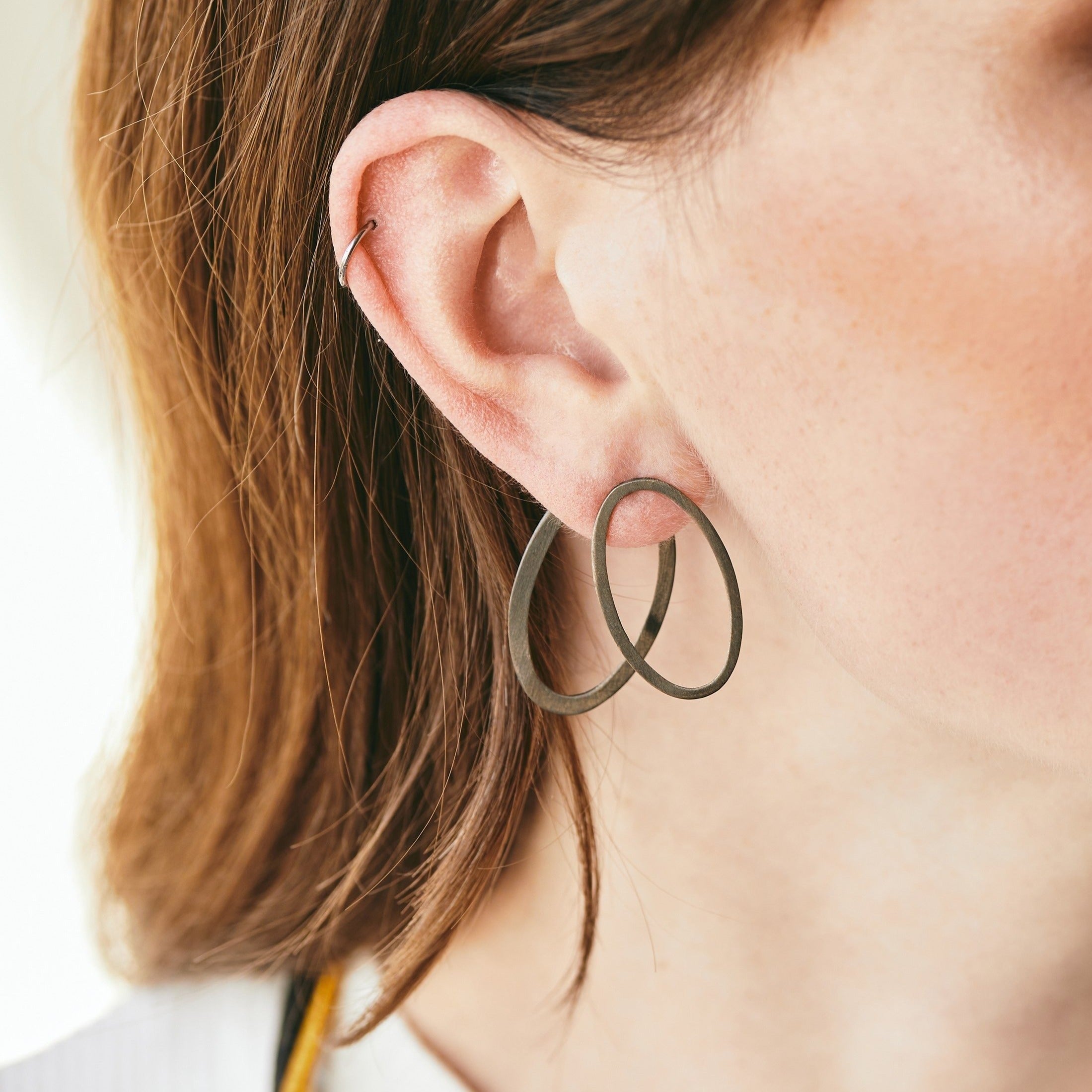 Oval ear jacket earrings